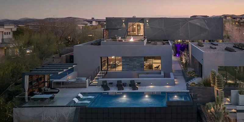 Luxury mansion in Ascaya, Henderson, sold for $20.5 million. Sun West Custom Homes designed this 12,101 sq ft single-story home on 2.27 acres, featuring 6 beds, 6 baths, and a 6-car garage. Resort-style living with indoor/outdoor spaces and stunning Strip views. Massive swimming pool with a cold plunge and spa. Modern luxury and breathtaking vistas make this home truly exceptional. Realtor expertise for buying or selling homes. Celebrating 30 years of selling New and Resale Homes. Contact us at jennifer@smithteamlasvegas.com. ISellLasVegas!